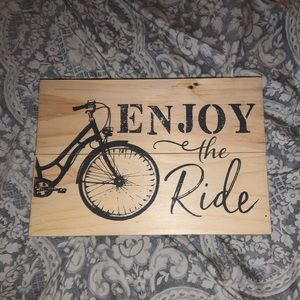 “Enjoy the ride” wooden sign